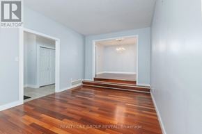 Whitby (Blue Grass Meadows) apartment for rent - A room with wooden floors and white walls.