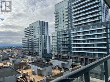 Vaughan (Vaughan Corporate Centre) condo for rent - A cityscape with modern buildings and a cloudy sky.