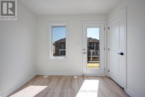 Brampton (Northwest Brampton) townhouse for rent - A white room with a window and a door.