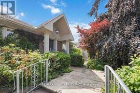 Toronto (Maple Leaf) apartment for rent - A house with a white fence and a gate is for sale.