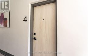 Toronto (Mimico) condo for rent - A door with a number 4 on the wall above it.