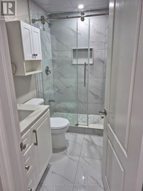 Brampton (Credit Valley) apartment for rent - A white bathroom with a glass shower stall.