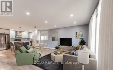 Kitchener apartment for rent - A modern living room with a green sofa and a television.