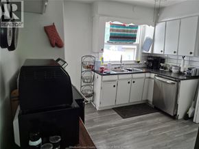 Kingsville apartment for rent - A kitchen with a black grill on the counter.