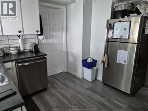 Kingsville apartment for rent - A kitchen with a refrigerator, toaster, and a dishwasher.