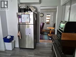 Kingsville apartment for rent - A kitchen with a fridge and a microwave.