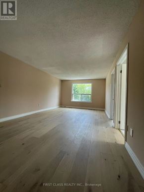Toronto (Hillcrest Village) apartment for rent - A room with wooden flooring and a window letting in natural light.