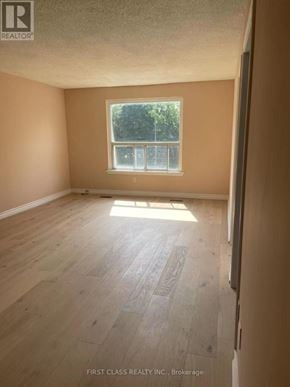 Toronto (Hillcrest Village) apartment for rent - A room with wooden flooring and a window letting in sunlight.