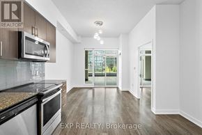 Mississauga (Creditview) condo for rent - A kitchen with a microwave, oven, and cabinets.