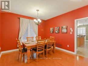 Brampton (Bramalea North Industrial) apartment for rent - A dining room with a wooden table and chairs.