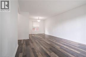 Waterloo apartment for rent - A room with wooden flooring and white walls.