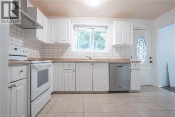 Waterloo apartment for rent - A kitchen with white cabinets and a window.