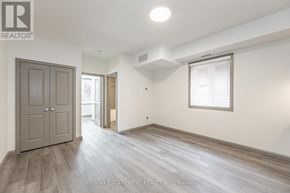Hamilton (Landsdale) multi-family for rent - A spacious room with a wooden floor and a large door.