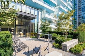 Vancouver apartment for rent - A modern outdoor seating area with wooden floors and benches.