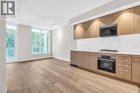 Vancouver apartment for rent - A modern kitchen with wooden cabinets and a stove top oven.