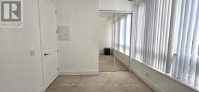 Toronto (Bay Street Corridor) condo for rent - A white hallway with a Realtor sign on the wall.