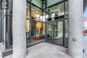 Ottawa condo for rent - The entrance to a building with a glass door and a sign that reads "180 George".