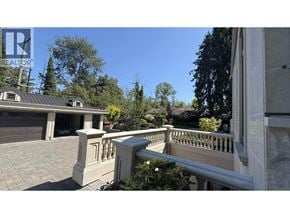 Vancouver apartment for rent - A house with a garage and a balcony.