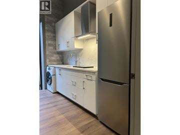 Vancouver apartment for rent - A modern kitchen with a stainless steel refrigerator.