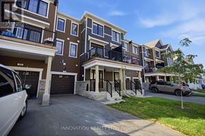 Ottawa townhouse for rent - A row of townhouses with balconies and garages are shown.