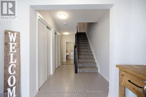 Ottawa townhouse for rent - A hallway with a staircase and a sign that says "Welcome".