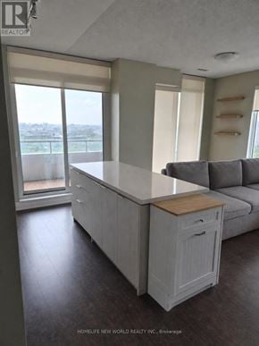 Markham (Unionville) condo for rent - A kitchen with a large island and a couch.