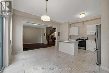 Severn (West Shore) apartment for rent - A spacious kitchen with white cabinets and a central island.