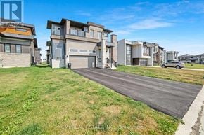 Severn (West Shore) apartment for rent - A row of modern houses with a grassy area in front.