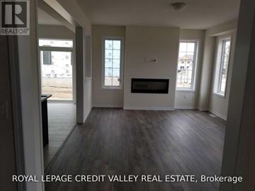 Haldimand apartment for rent - A living room with a fireplace and a tv on the wall.