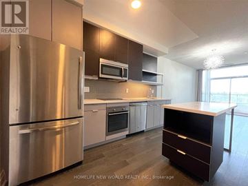 Toronto (Willowdale East) condo for rent - A modern kitchen with stainless steel appliances and a wooden island.