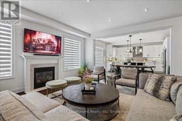 Oakville (Wm Westmount) apartment for rent - A living room with a fireplace and a television on the wall.