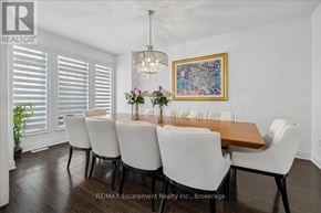 Oakville (Wm Westmount) apartment for rent - A dining room with a long table and chairs.