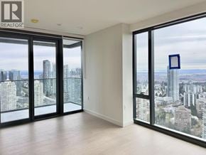 Burnaby apartment for rent - A realtor's office with a view of the city.