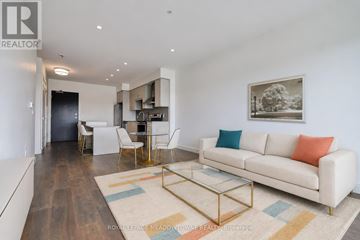Cambridge condo for rent - A living room with a white couch and a coffee table.