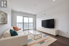 Cambridge condo for rent - A living room with a couch, a coffee table, and a television.