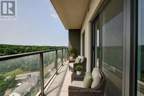 Cambridge condo for rent - A balcony with a table and chairs overlooking a residential area.