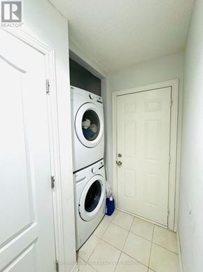 Brampton (Bram East) apartment for rent - A laundry room with a washer and dryer in it.