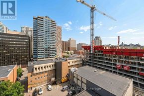Ottawa condo for rent - A construction site with a crane and a building under construction.