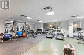 Ottawa condo for rent - A gym with a variety of equipment including treadmills, weights, and exercise machines.