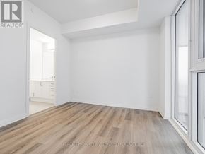 Vaughan (Vellore Village) condo for rent - A room with wooden flooring and white walls, with a window on the right side.