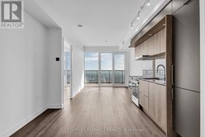 Mississauga (City Centre) condo for rent - A well-lit, spacious kitchen and living room with wooden floors and modern appliances.