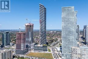 Mississauga (City Centre) condo for rent - A cityscape with tall buildings and a clear sky.