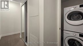 Toronto (Forest Hill South) condo for rent - A white washing machine in a laundry room.
