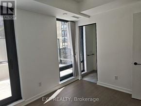 Toronto (Forest Hill South) condo for rent - A room with a sliding glass door leading to a balcony.