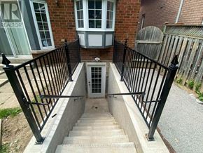 Ajax (Central West) apartment for rent - A brick house with a staircase leading to a door.