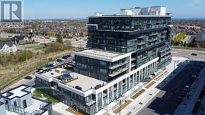 Oakville (Go Glenorchy) condo for rent - A modern multi-story building with glass windows and balconies is surrounded by a parking lot and other buildings.