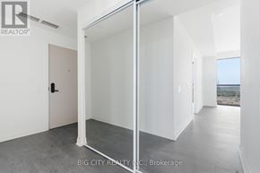 Toronto (Leaside) condo for rent - A white room with a sliding door and a view of the outside.
