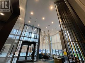 Toronto (Willowdale East) condo for rent - A large glass door with a sign that says "REALTOR" on it.