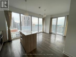 Toronto (Willowdale East) condo for rent - A spacious living room with a large window overlooking the city.