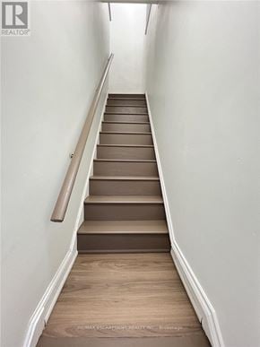 Hamilton (Crown Point) duplex for rent - A staircase with wooden steps and a handrail.
